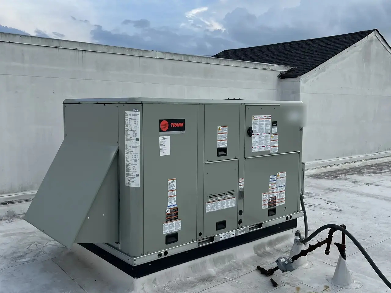 Commercial rooftop packaged HVAC unit viewed from the access side