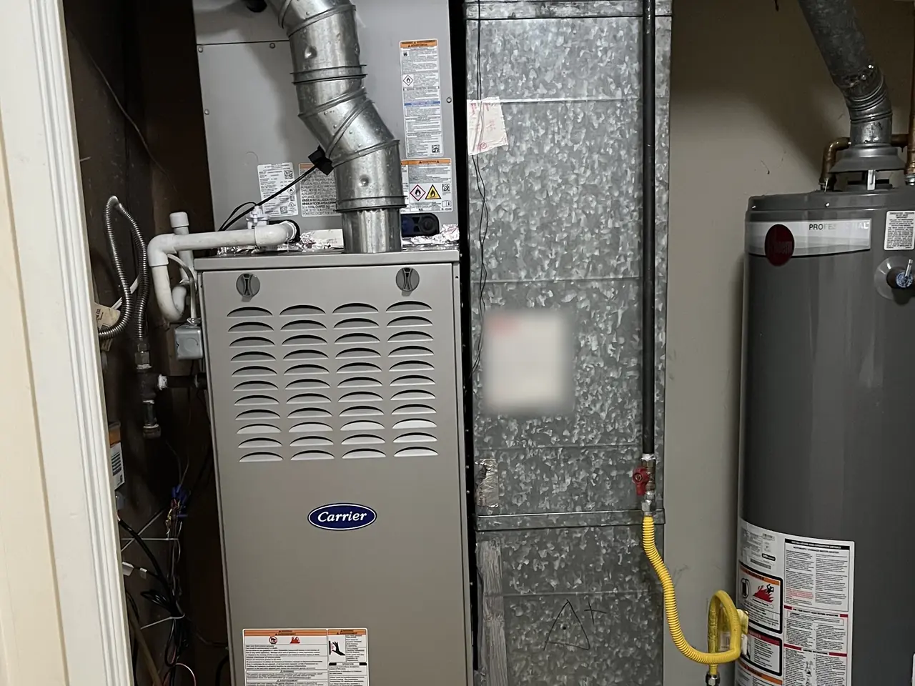 Indoor HVAC equipment and sheet-metal ductwork in a utility closet